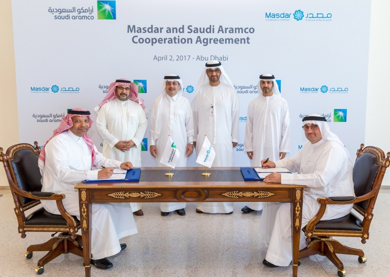 Officials from ADNOC, Masdar and Saudi Aramco during the MoU signing