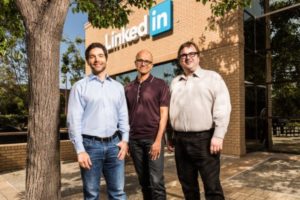 Microsoft CEO Satya Nadella (center) stands with LinkedIn CEO Jeff Weiner (left) and LinkedIn chairman and co-founder Reid Hoffman
