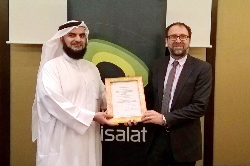 Ahmed Mohamed Darwish, Senior Vice President, Customer Service Engineering receiving the ISO certification from Lloyds