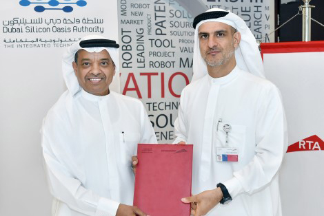 Dr Juma Al Matrooshi and Ahmed Bahrozyan with the MoU