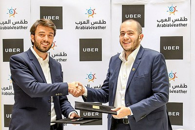 Uber Jordan Country Manager Hamdi Tabaa and ArabiaWeather CEO Mohammed Al-Shaker 