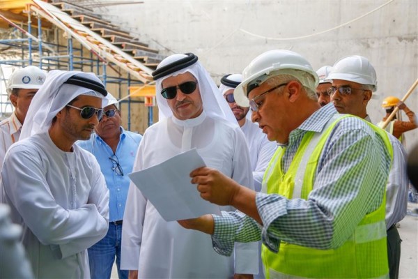 Saeed Mohammed Al Tayer is shown plans at the R&D site within the solar park