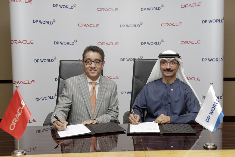 Oracle’s business applications SVP for the ECEMEA region Arun Khehar and DP World Group chairman and CEO Sultan Ahmed Bin Sulayem and at the signing of the agreement