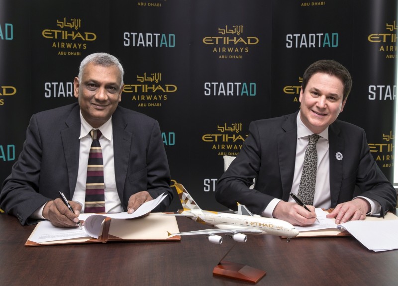 Ramesh Jagannathan, managing director of startAD and Vice Provost for innovation and entrepreneurship at NYU Abu Dhabi and Peter Baumgartner, Etihad Airways Chief Executive Officer sign the MoU